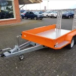 Baumaschinenanhänger 3000 kg in Orange Seitenansicht